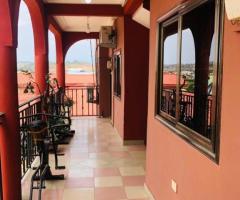 TWO BEDROOMS APARTMENT AT AYIGBE TOWN CLOSE TO WEST HILLS MALL