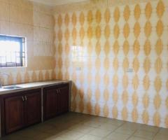 TWO BEDROOMS APARTMENT AT AYIGBE TOWN CLOSE TO WEST HILLS MALL